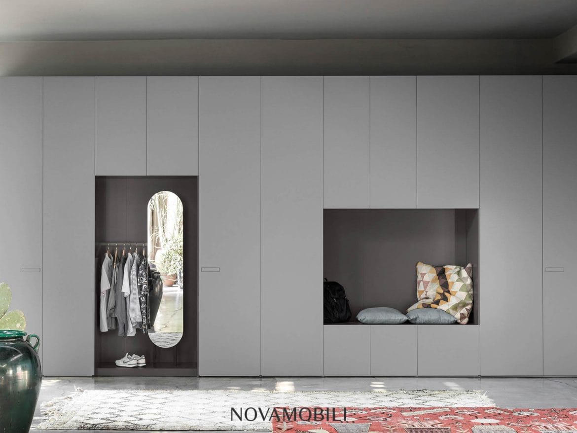 Wardrobe space in grey designer bedroom by Hubble