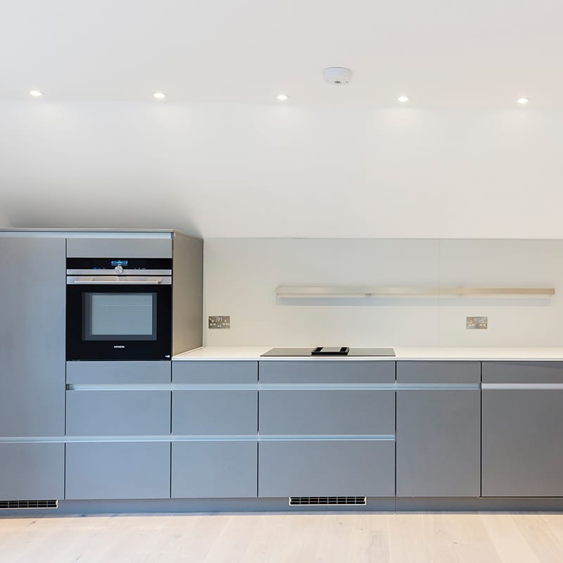 Modern grey designer kitchen fitting by Hubble