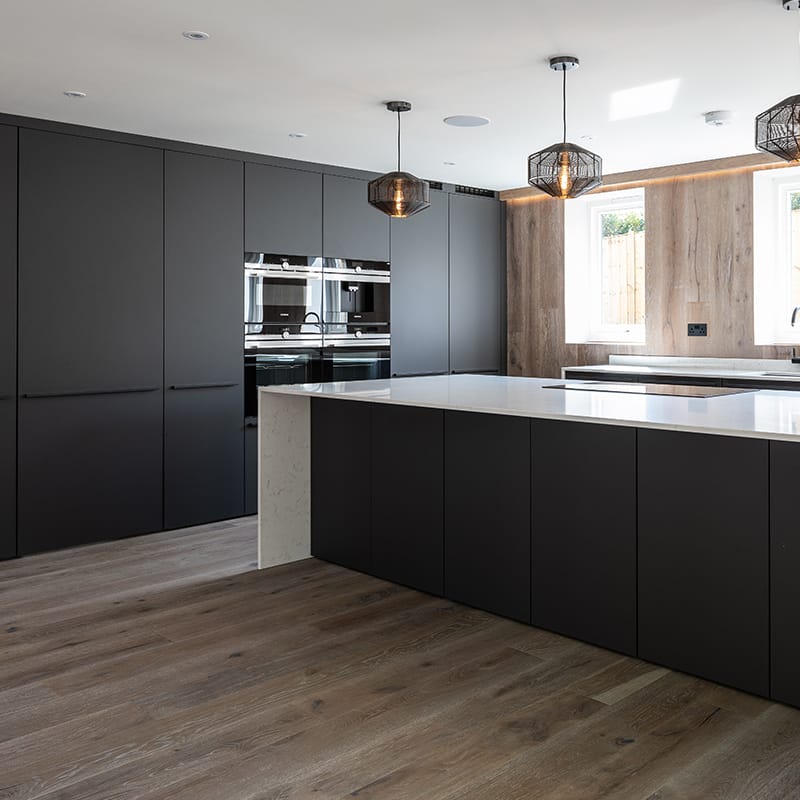 Black designer kitchen in West Sussex by Hubble
