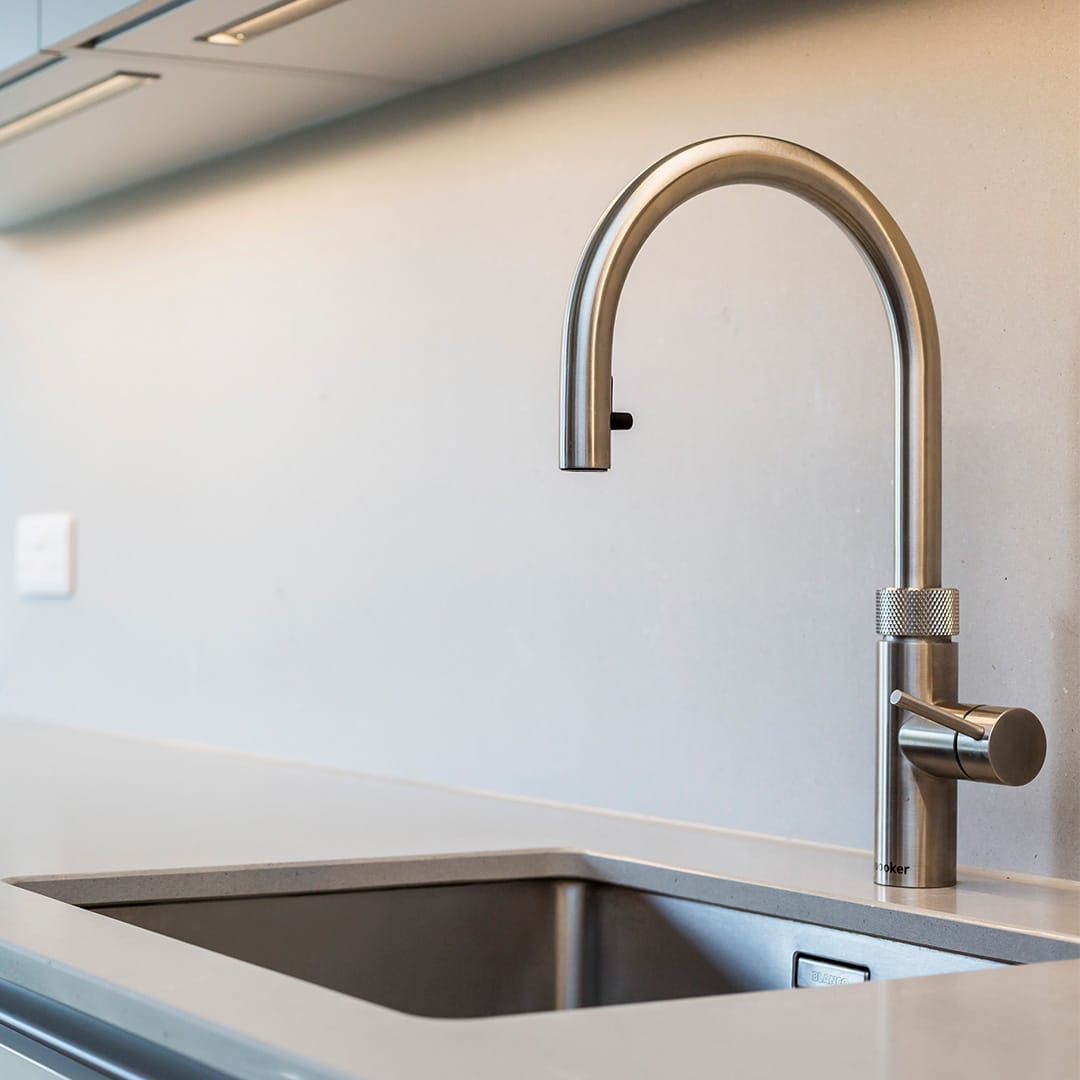 Modern sink and tap in minimal kitchen design fitting by Hubble
