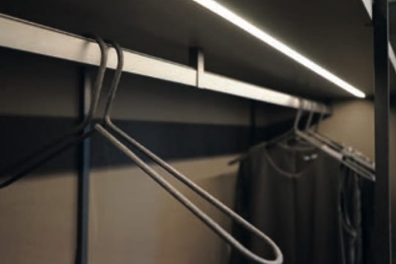 Hanging rail inside lit wardrobe - Hubble Kitchens